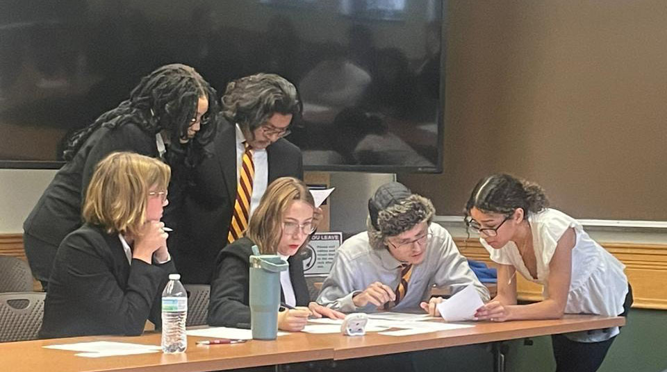 2024-2025 Ethics Bowl Team members competing at the Upper Midwest Regional Ethics Bowl